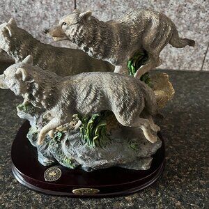 The Canadian Wilderness Vintage Comega 3 wolves on wooden base